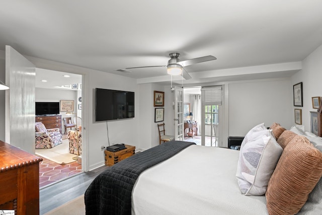 bedroom with ceiling fan and hardwood / wood-style flooring