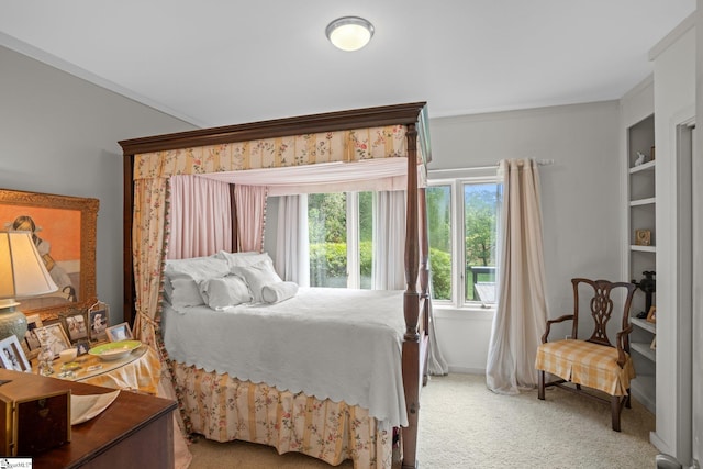 bedroom featuring crown molding and carpet floors