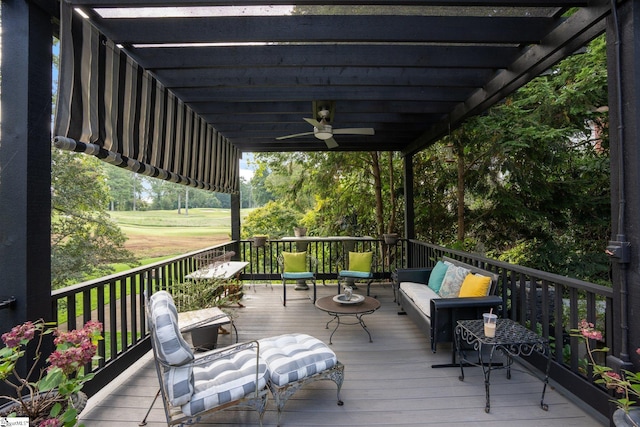 wooden deck featuring ceiling fan