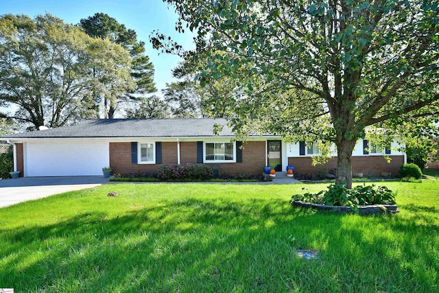 ranch-style house featuring a front yard and a garage