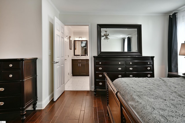 bedroom featuring ensuite bathroom, hardwood / wood-style flooring, and ornamental molding