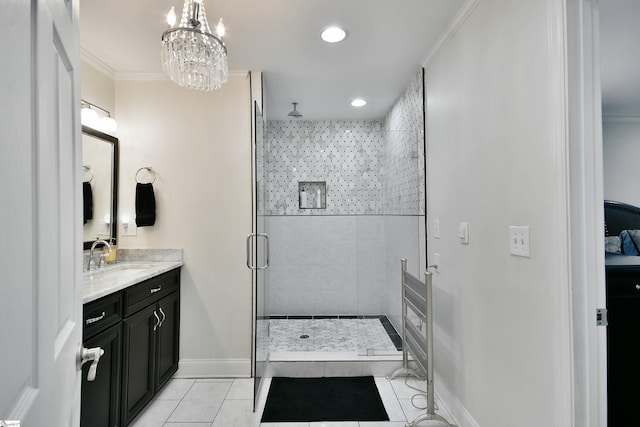 bathroom with vanity, an enclosed shower, tile patterned floors, and crown molding