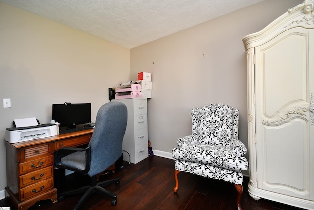 office space featuring a textured ceiling and dark hardwood / wood-style flooring