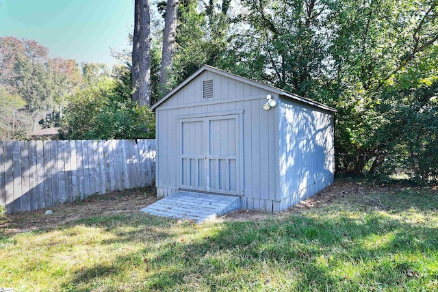 view of outdoor structure with a lawn