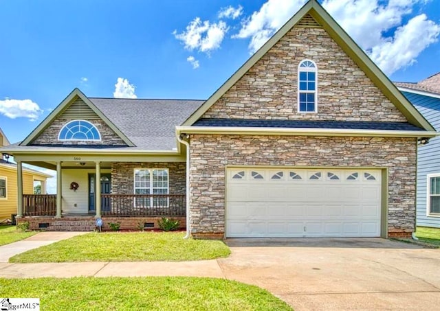 view of front of home with a porch, a front yard, and a garage