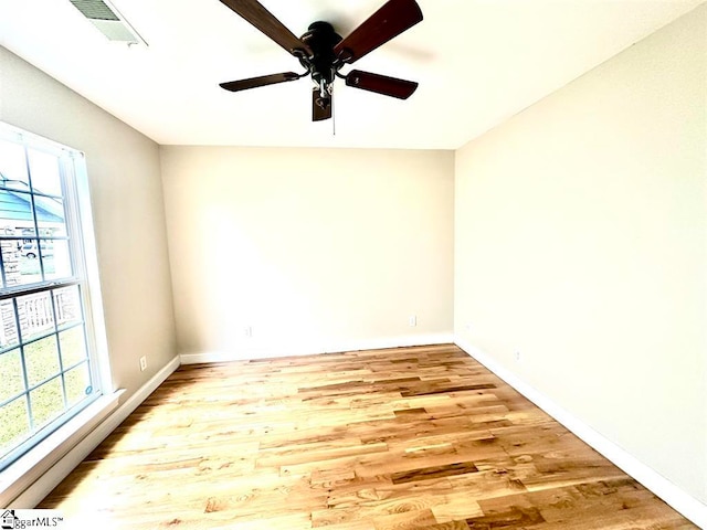 unfurnished room featuring light hardwood / wood-style flooring and ceiling fan