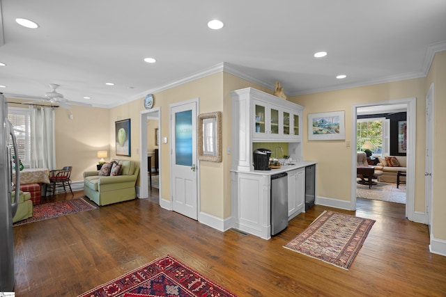 kitchen featuring crown molding, white cabinetry, and dark hardwood / wood-style floors