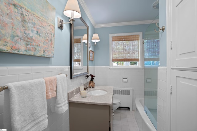 full bathroom featuring tile walls, vanity, radiator heating unit, and toilet