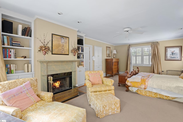 carpeted bedroom with crown molding and ceiling fan