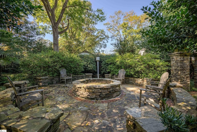 view of patio / terrace with an outdoor fire pit