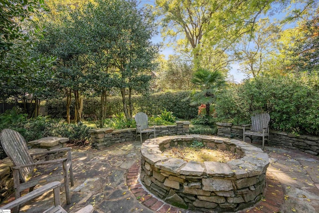 view of patio / terrace with an outdoor fire pit