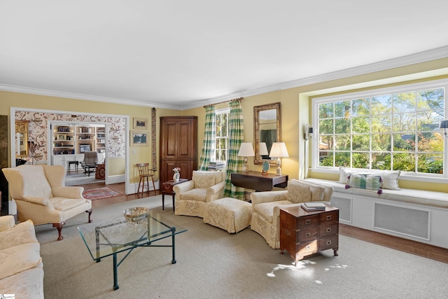 living room featuring light hardwood / wood-style flooring and ornamental molding