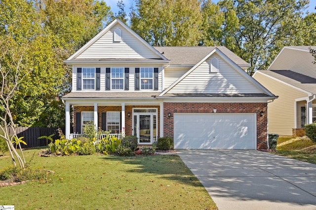 view of front of home featuring a front yard, a porch, and a garage