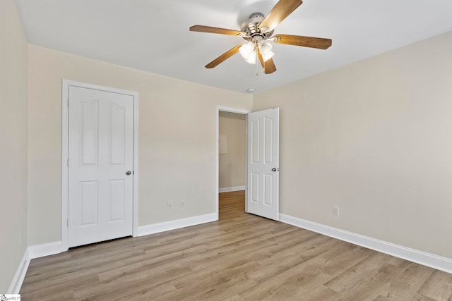 unfurnished bedroom with light wood-type flooring and ceiling fan