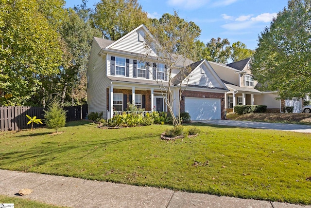 front facade featuring a porch, a front lawn, and a garage