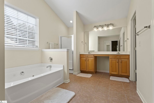 bathroom with vanity, shower with separate bathtub, lofted ceiling, and tile patterned flooring