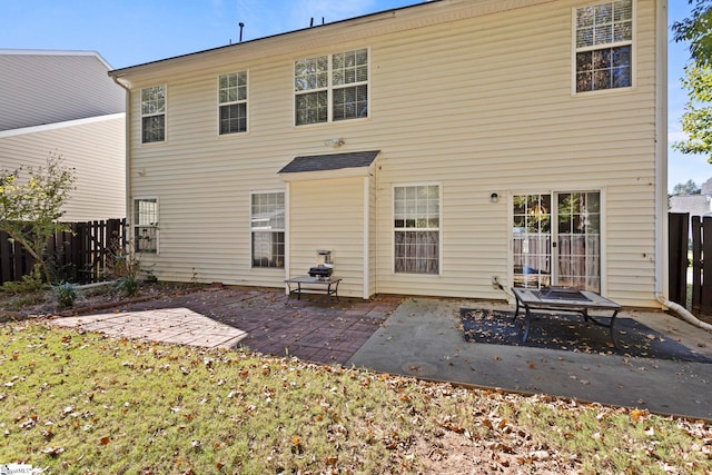 rear view of house with a patio