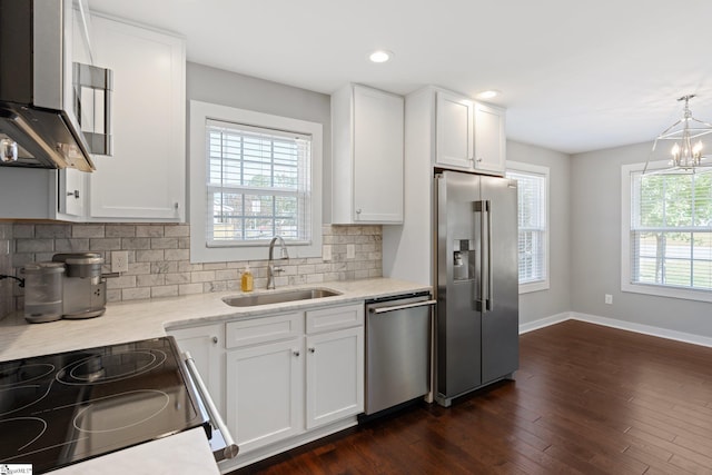 kitchen featuring white cabinetry, stainless steel appliances, and sink