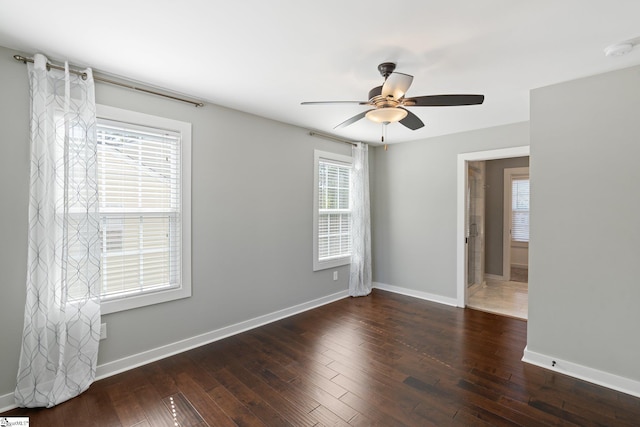 unfurnished room featuring dark hardwood / wood-style floors and ceiling fan