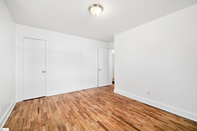 spare room with light hardwood / wood-style flooring