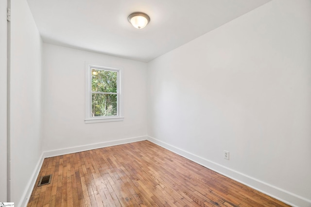 empty room featuring hardwood / wood-style flooring