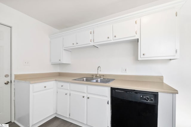 kitchen featuring black dishwasher, sink, white cabinets, and dark wood-type flooring