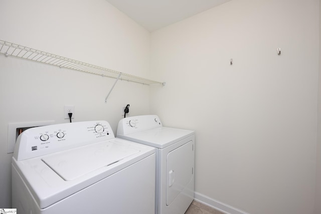 laundry area with washer and clothes dryer