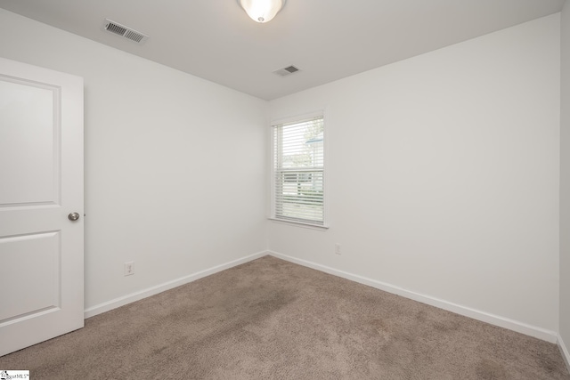 empty room with carpet flooring