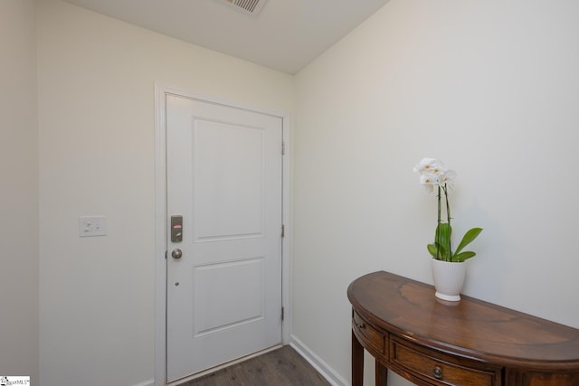 doorway featuring dark hardwood / wood-style floors