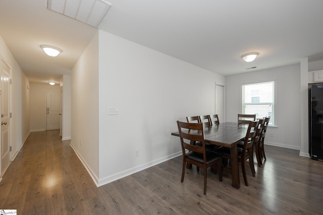 dining area featuring dark hardwood / wood-style flooring