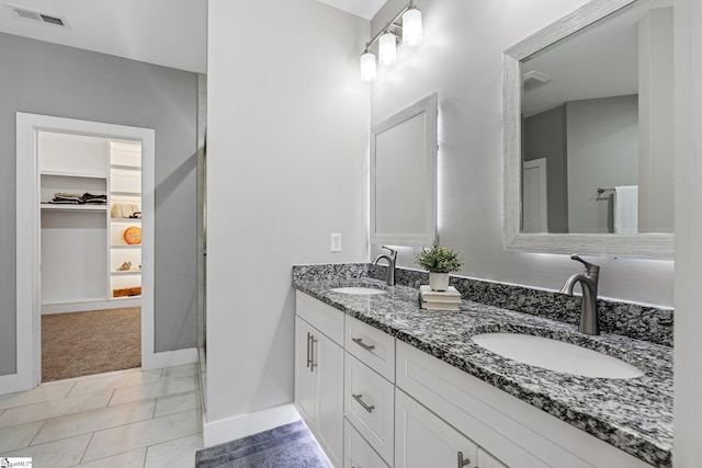 bathroom featuring vanity and tile patterned flooring