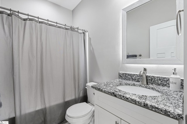 full bathroom featuring vanity, toilet, and shower / bath combo with shower curtain