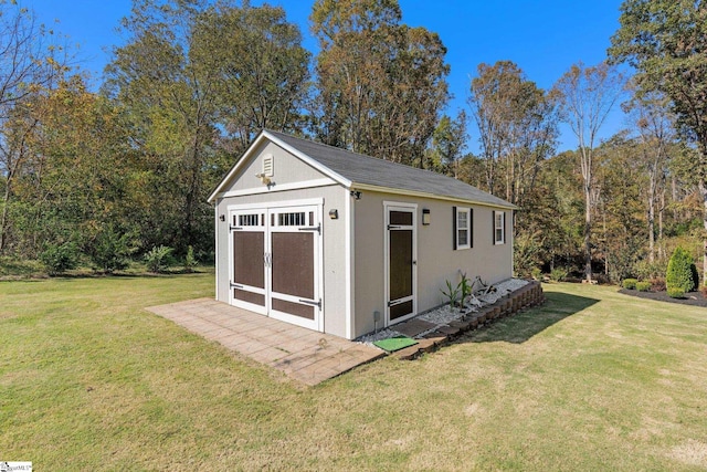 view of outdoor structure featuring a yard