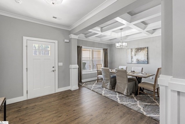 dining room featuring crown molding, dark hardwood / wood-style flooring, coffered ceiling, beam ceiling, and an inviting chandelier