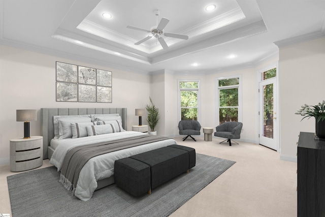 bedroom featuring ceiling fan, crown molding, a raised ceiling, and access to exterior