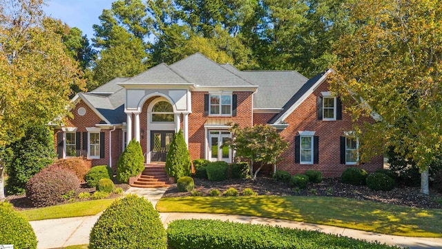 view of front facade featuring a front lawn and french doors