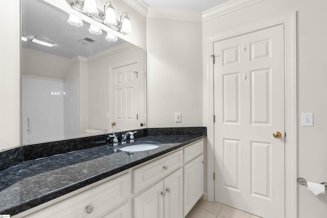 bathroom featuring vanity, ornamental molding, toilet, and tile patterned flooring