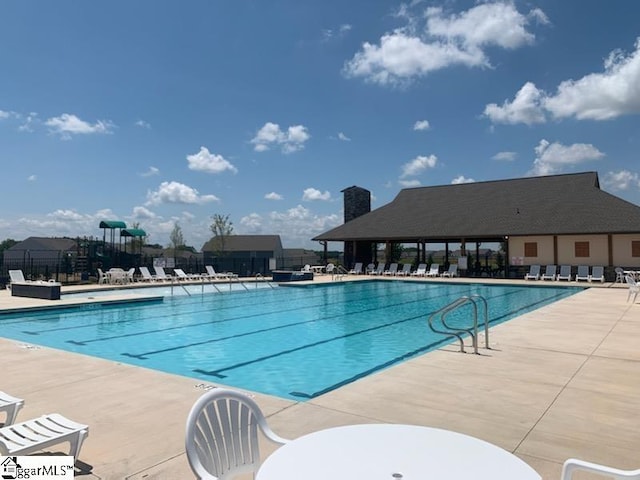 view of swimming pool featuring a patio