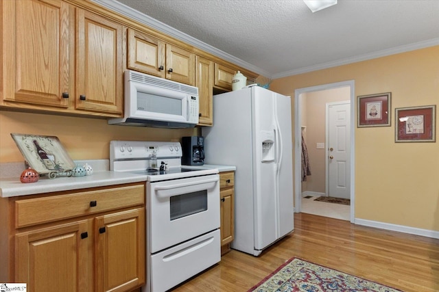 kitchen with white appliances, ornamental molding, a textured ceiling, and light wood-type flooring