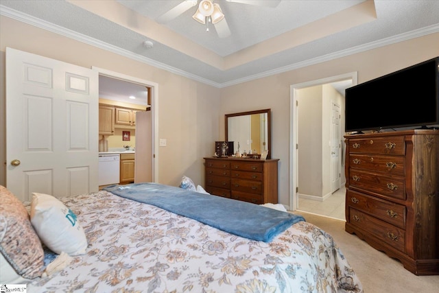 carpeted bedroom featuring ceiling fan, crown molding, and ensuite bathroom