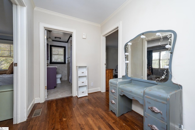 hallway featuring crown molding and dark hardwood / wood-style floors