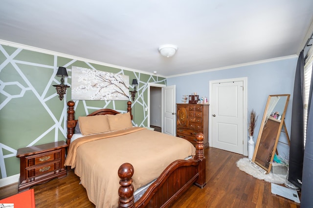 bedroom with crown molding and dark hardwood / wood-style floors