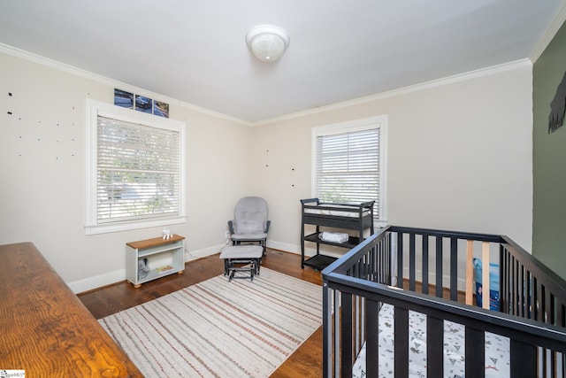 bedroom with multiple windows, dark hardwood / wood-style floors, and crown molding