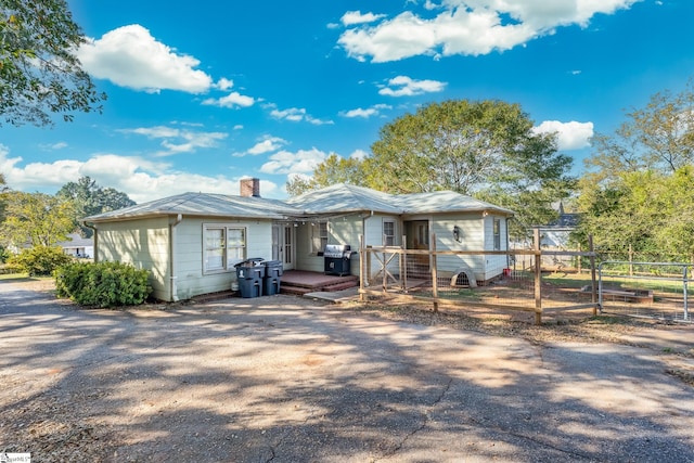 view of front of property featuring a wooden deck