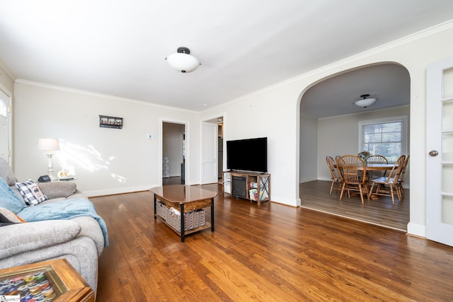 living room with crown molding and dark hardwood / wood-style floors