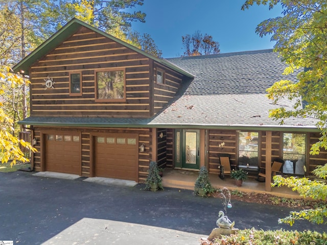 log cabin with a garage