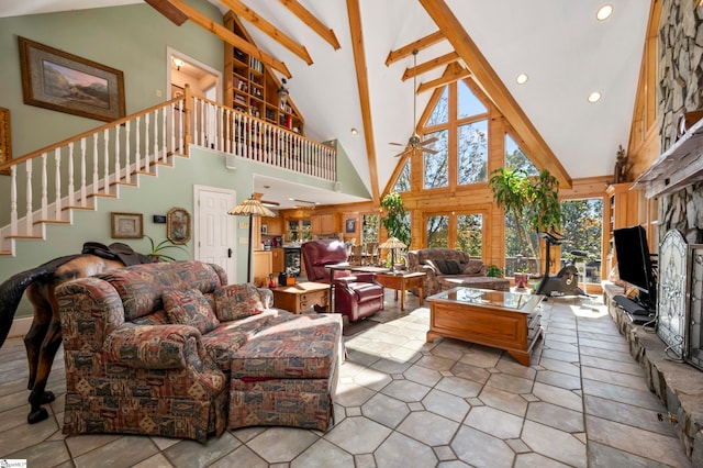 living room with a fireplace, high vaulted ceiling, and beamed ceiling