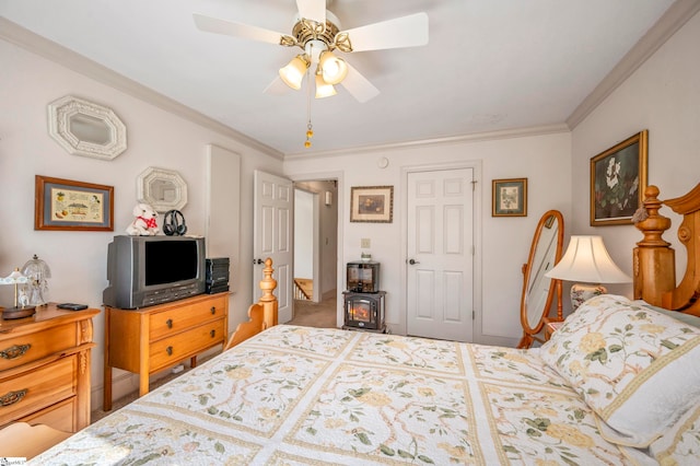 bedroom with ceiling fan and crown molding