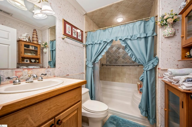 bathroom featuring crown molding, vanity, and toilet