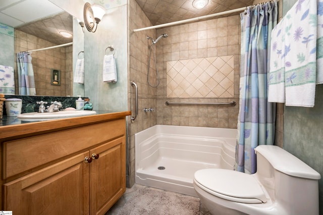 bathroom featuring curtained shower, vanity, and toilet